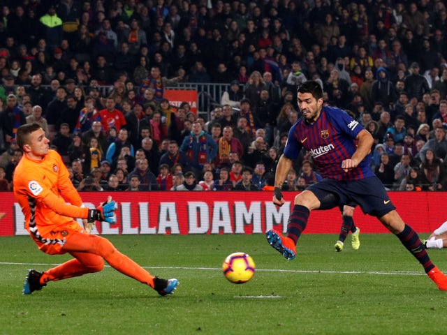 Luis Suarez is denied by Jordi Masip in Barcelona's La Liga meeting with Real Valladolid on February 16