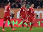 Bayern Munich's players look dejected after scoring an own goal against Augsburg on February 15, 2019