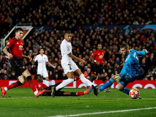 Paris Saint-Germain forward Kylian Mbappe scores against Manchester United on February 12, 2019