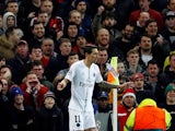 Paris Saint-Germain midfielder Angel Di Maria has a bottle thrown at him during the Champions League cash with Manchester United on February 12, 2019