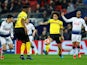 Borussia Dortmund's Axel Witsel in action with Tottenham's Son Heung-min and Lucas Moura on February 13, 2019