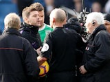 Tottenham Hotspur manager Mauricio Pochettino confronts referee Mike Dean after his side's defeat to Burnley on February 23, 2019