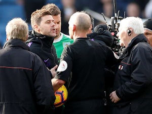 Tottenham Hotspur manager Mauricio Pochettino confronts referee Mike Dean after his side's defeat to Burnley on February 23, 2019
