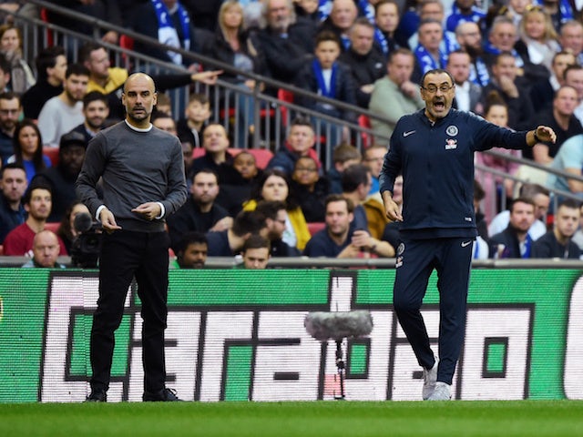 Chelsea manager Maurizio Sarri and Manchester City counterpart Pep Guardiola watch on during the EFL Cup final on February 24, 2019