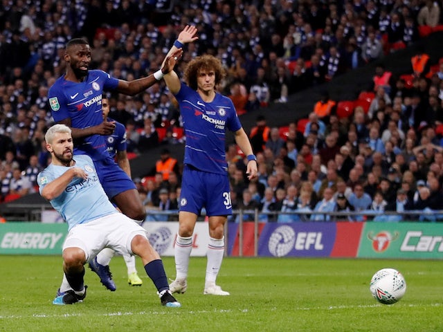 Manchester City striker Sergio Aguero scores from an offside position during the EFL Cup final against Chelsea on February 24, 2019