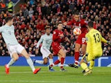 Liverpool goalkeeper Alisson saves from Joel Matip during the Champions League clash with Bayern Munich on February 19, 2019