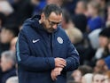 Under-fire Chelsea manager Maurizio Sarri checks his watch on February 21, 2019
