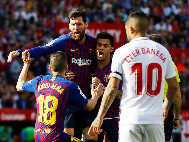 Lionel Messi celebrates scoring Barcelona's first goal against Sevilla in their La Liga clash on February 23, 2019
