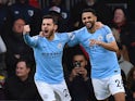 Manchester City's Riyad Mahrez celebrates with Bernardo Silva after opening the scoring against Bournemouth on March 2, 2019