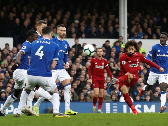 Liverpool forward Mohamed Salah curls a shot on goal during the Merseyside derby meeting with Everton on March 3, 2019