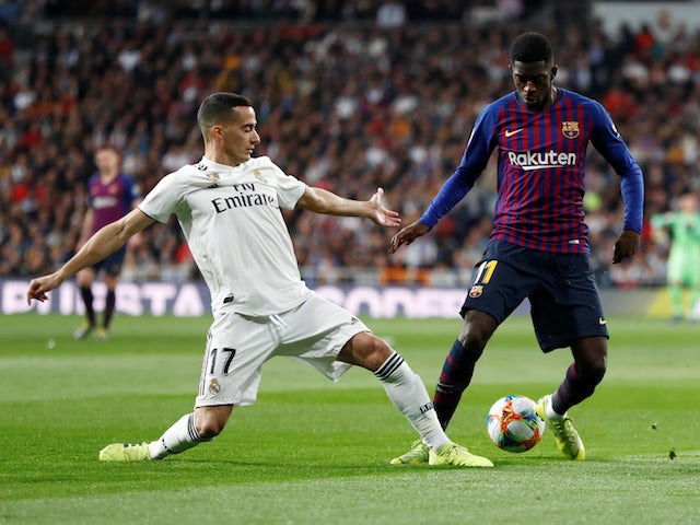 Barcelona's Ousmane Dembele tangles with Real Madrid's Lucas Vazquez in the Copa del Rey on February 27, 2019