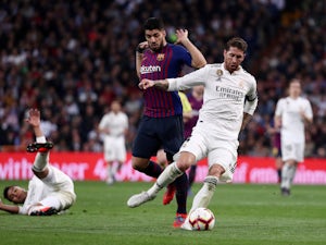 Barcelona's Luis Suarez chases down Real Madrid's Sergio Ramos during El Clasico on March 2, 2019