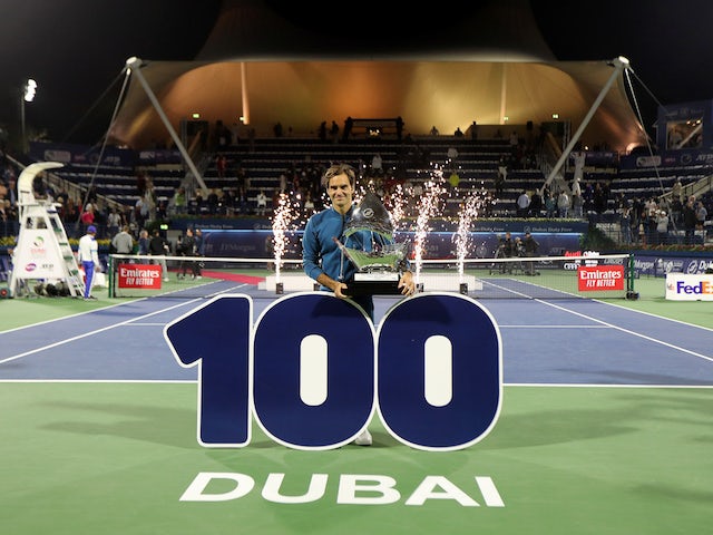 Roger Federer celebrates winning his 100th ATP singles title in Dubai on March 2, 2019
