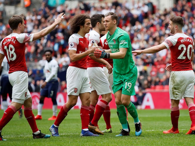 Arsenal players congratulate Bernd Leno for a double save in the North London derby with Tottenham Hotspur on March 2, 2019