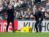 Managers Mauricio Pochettino and Unai Emery watch on during the North London derby on March 2, 2019