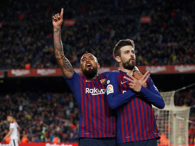 Gerard Pique celebrates his goal for Barcelona against Rayo Vallecano in La Liga on March 9, 2019