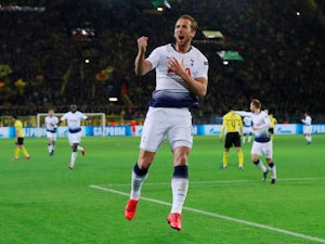Record-breaking Kane fires Spurs into quarters