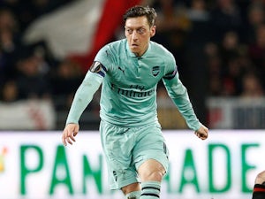 Mesut Ozil 'determined to stay at Arsenal'