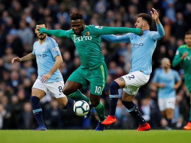 Kyle Walker and Isaac Success fight for the ball as Manchester City play Watford in the Premier League on March 9, 2019.