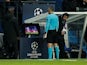 Referee Damir Skomina watches the VAR monitor during the Champions League game between Paris Saint-Germain and Manchester United on March 6, 2019
