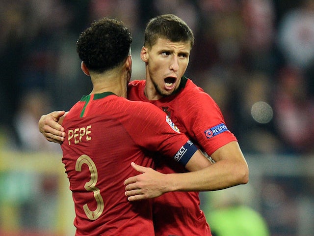Benfica's Ruben Dias celebrates with Portugal teammate Pepe in the UEFA Nations League in October, 2018