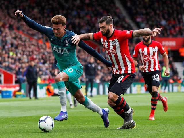 Tottenham's Dele Alli in action with Southampton's Charlie Austin on March 9, 2019