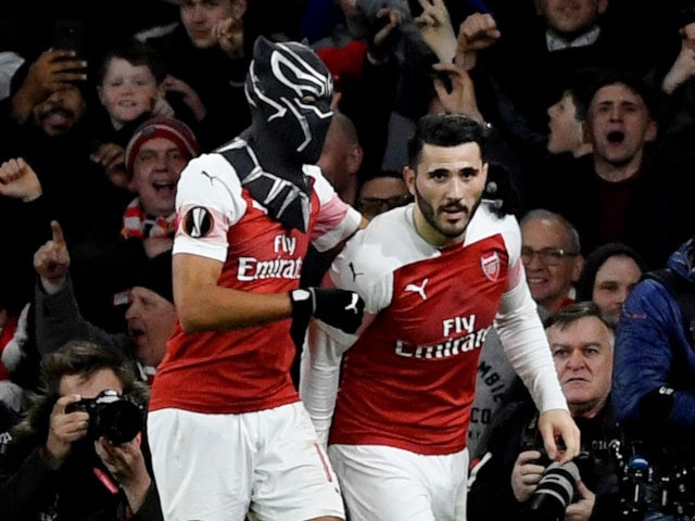 Arsenal striker Pierre-Emerick Aubameyang dons a mask after bagging his second against Rennes on March 14, 2019