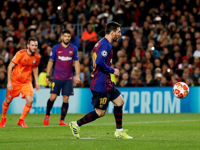 Barcelona's Lionel Messi scores from the penalty spot against Lyon in the Champions League on March 13, 2019