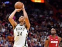 Milwaukee Bucks forward Giannis Antetokounmpo (34) at the free throw line as Miami Heat guard Dwyane Wade (3) looks on during the second half at American Airlines Arena on March 16, 2019