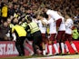 Aston Villa's Kortney Hause celebrates scoring their third goal against Nottingham Forest as stewards apprehend a fan on March 13, 2019