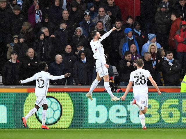 Swansea City's Matt Grimes celebrates scoring their first goal against Manchester City on March 16, 2019