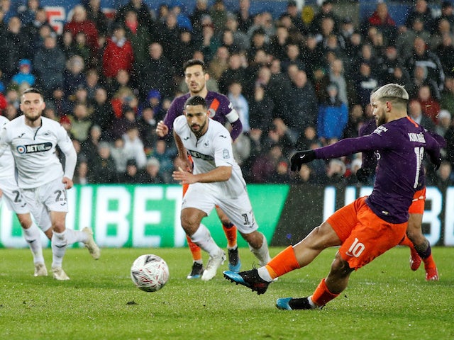 Manchester City striker Sergio Aguero forces an own goal with a penalty against Swansea on March 16, 2019