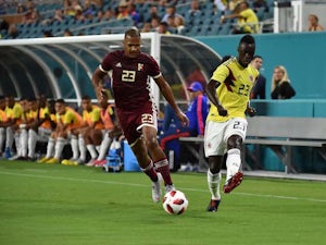 Colombia's Davinson Sanchez battles Venezuela's Salomon Rondon for the ball in September, 2018