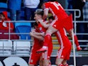 Daniel James is mobbed by Wales teammates after scoring on March 24, 2019