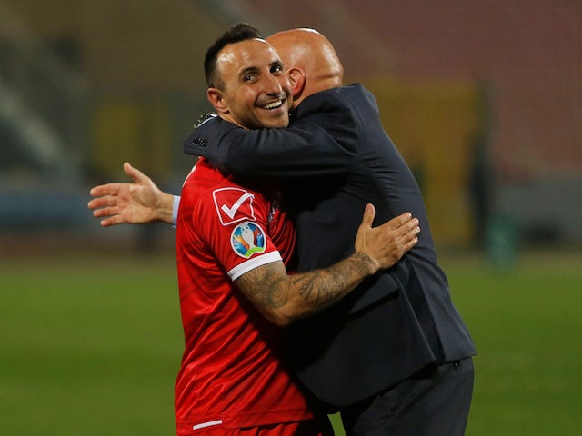 Michael Mifsud and Ray Farrugia celebrate Malta's win over Faroe Islands on March 23, 2019
