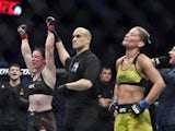 Molly McCann (red gloves) defeats Priscila Cachoeira (blue gloves) during UFC Fight Night at O2 Arena in March 2019