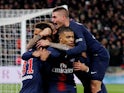 Paris St Germain's Kylian Mbappe celebrates scoring their first goal against Marseille with Marco Verratti and teammates On March 17, 2019