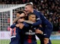 Paris St Germain's Kylian Mbappe celebrates scoring their first goal against Marseille with Marco Verratti and teammates On March 17, 2019