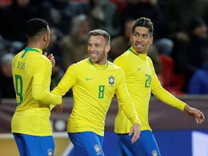 Brazil's Gabriel Jesus celebrates scoring their second goal with Arthur and Roberto Firmino on March 26, 2019