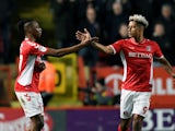 Charlton Athletic's Joe Aribo celebrates a goal with teammate Lyle Taylor in March 2019