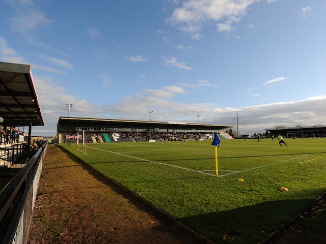Forest Green vow to ban fan after racist abuse delays Scunthorpe game
