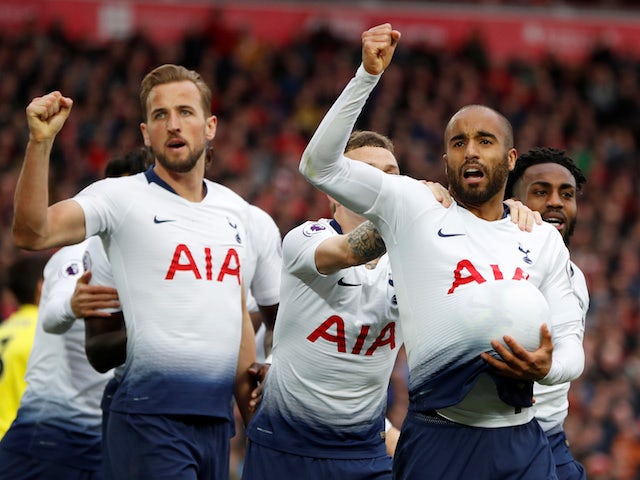 Tottenham Hotspur players celebrate Lucas Moura's goal against Liverpool in the Premier League on March 31, 2019