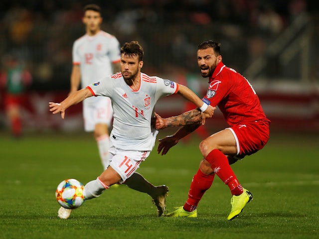 Spain's Juan Bernat turns away from Malta's Steve Borg during their Euro 2020 qualifier on March 26, 2019