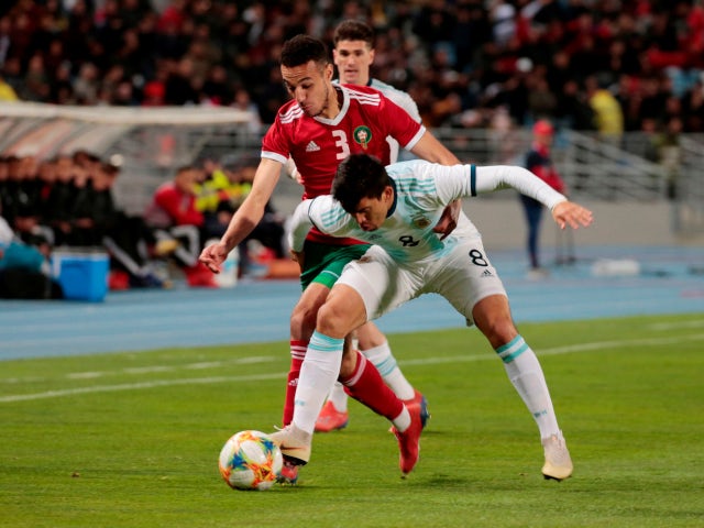 Morocco's Noussair Mazraoui in action with Argentina's Marcos Acuna during the international friendly on March 26, 2019