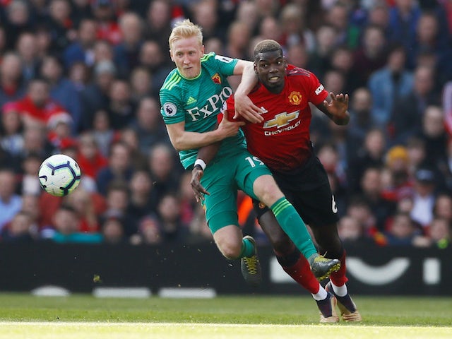 Manchester United's Paul Pogba tangles with Watford's Will Hughes during their Premier League clash on March 30, 2019