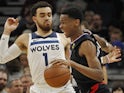 Los Angeles Clippers guard Shai Gilgeous-Alexander (2) dribbles around Minnesota Timberwolves guard Tyus Jones (1) in the fourth quarter at Target Center on March 27, 2019