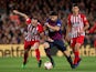 Barcelona's Luis Suarez battles with Atletico Madrid's Diego Godin in their La Liga clash on April 6, 2019