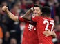 Bayern Munich's Robert Lewandowski celebrates scoring their fifth goal with David Alaba during their Bundesliga clash with Borussia Dortmund on April 6, 2019