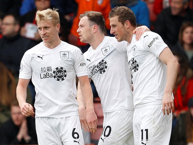 Ashley Barnes celebrates scoring with Ben Mee and Chris Wood on April 6, 2019