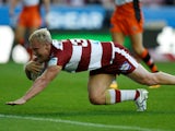 Gabe Hamlin scores a try for Wigan Warriors on August 10, 2018